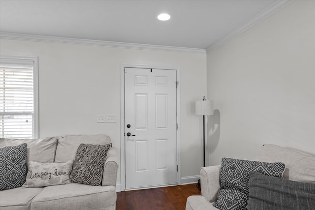 living room with dark hardwood / wood-style floors and crown molding