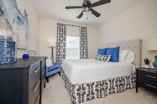 bedroom featuring ceiling fan and light colored carpet