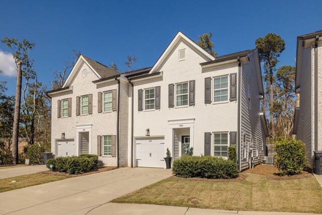 view of front of house with a front yard and a garage