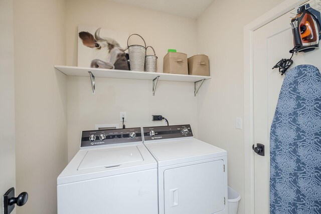 washroom with washer and dryer