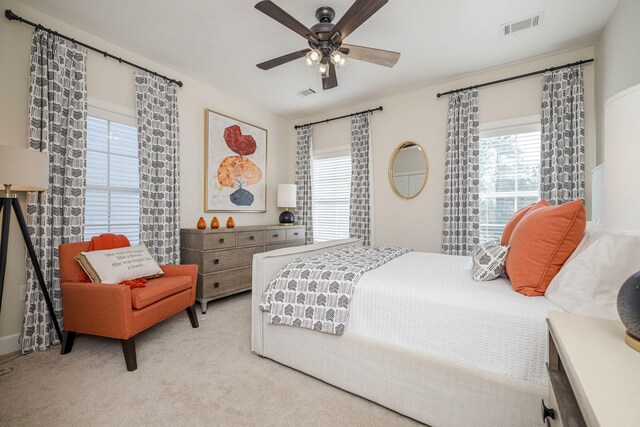 carpeted bedroom with ceiling fan