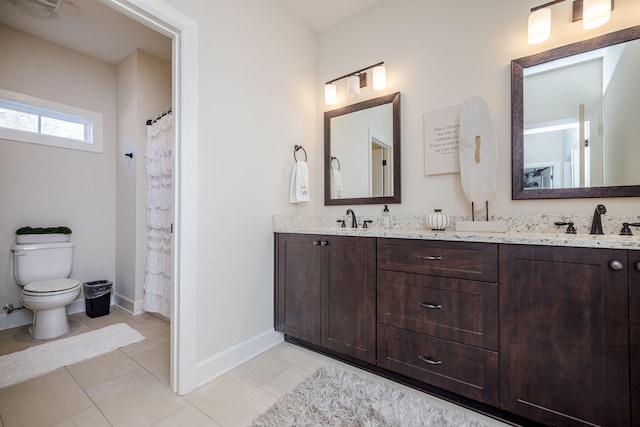 bathroom featuring tile patterned floors, vanity, toilet, and walk in shower