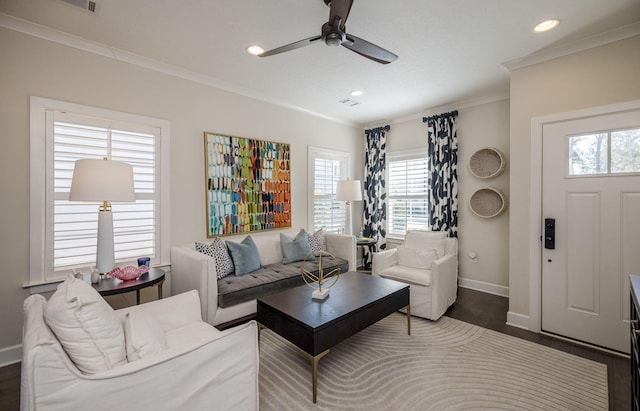 living room with dark hardwood / wood-style flooring, ceiling fan, and crown molding