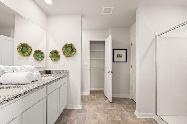 bathroom featuring vanity and walk in shower