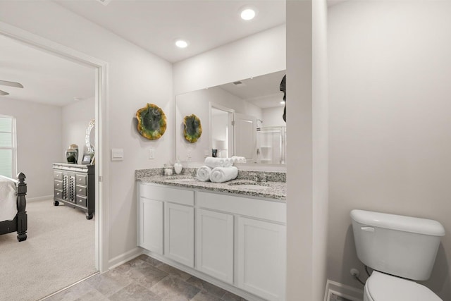 bathroom with vanity and toilet