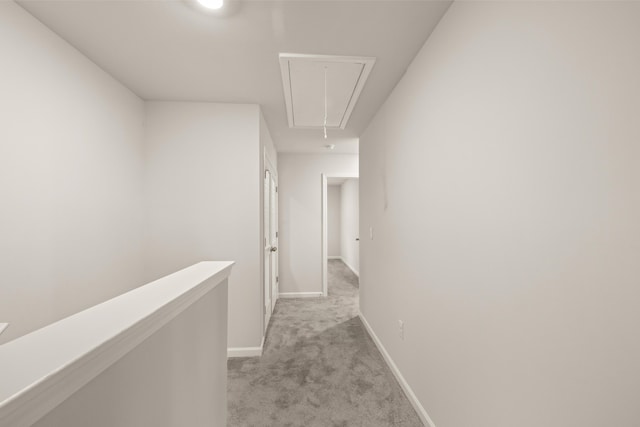 hallway with light colored carpet