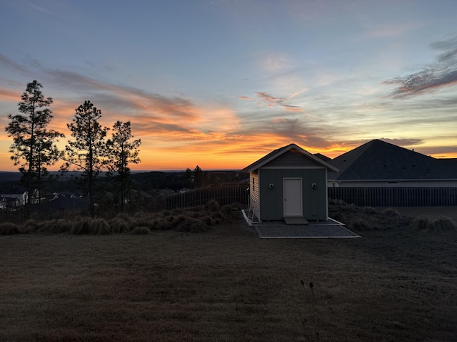 1391 Ackerman Dr, Graniteville, SC 29829 - outdoor structure at dusk with a storage unit, an outbuilding, and fence
