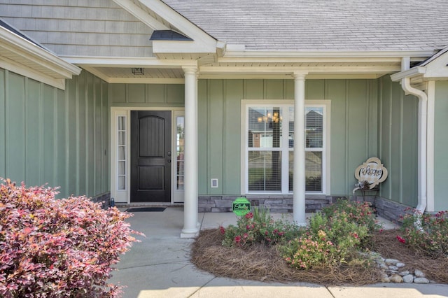 1391 Ackerman Dr, Graniteville, SC 29829 - view of exterior entry featuring covered porch, roof with shingles, and board and batten siding