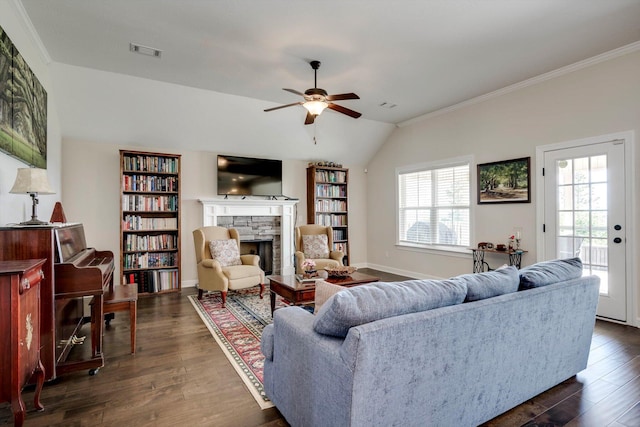 1391 Ackerman Dr, Graniteville, SC 29829 - living area with a stone fireplace, a ceiling fan, dark wood-style floors, vaulted ceiling, and crown molding