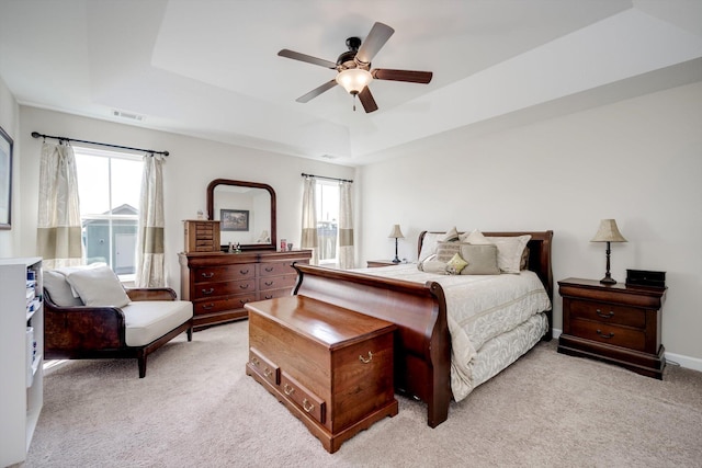 1391 Ackerman Dr, Graniteville, SC 29829 - bedroom with multiple windows, light colored carpet, a raised ceiling, and a ceiling fan