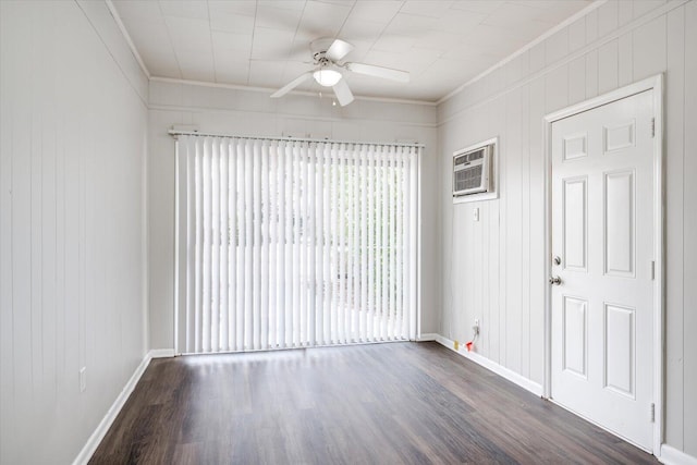 unfurnished room featuring dark wood finished floors, crown molding, baseboards, and ceiling fan