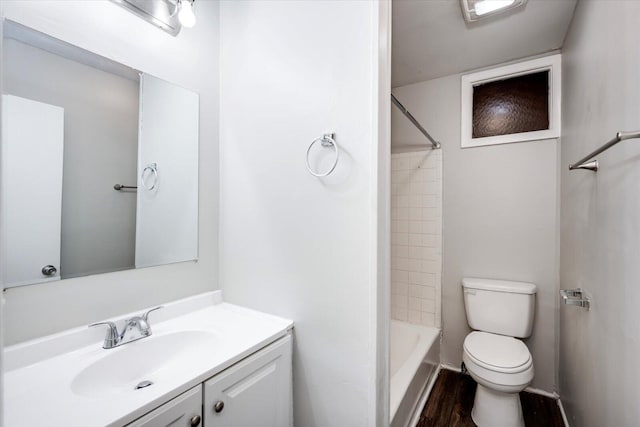 full bathroom featuring vanity, shower / tub combination, toilet, and wood finished floors