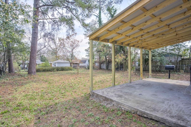 view of yard with a patio and fence