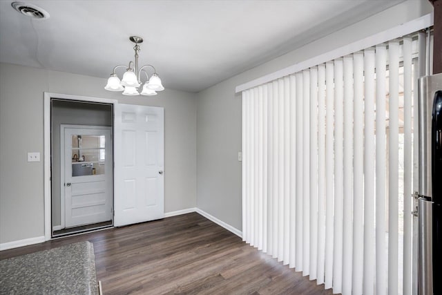 entrance foyer with visible vents, baseboards, an inviting chandelier, and dark wood-style flooring