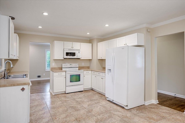 1702 Forest Creek Rd, Augusta, GA 30909 - kitchen featuring white appliances, light countertops, white cabinetry, recessed lighting, and ornamental molding