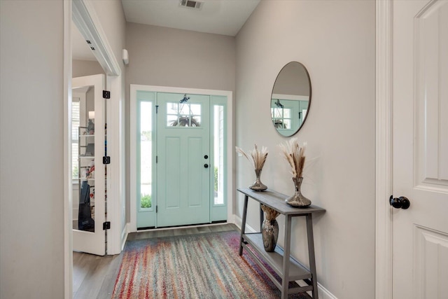 foyer with light hardwood / wood-style floors