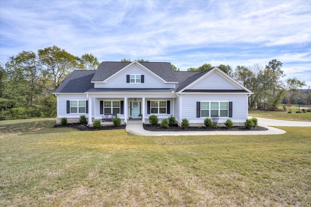 view of front of house featuring a front yard and covered porch