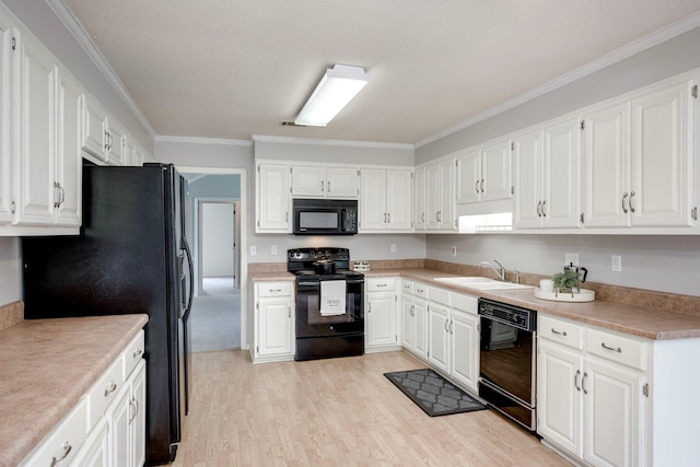 4593 Ashbrook Ct, Martinez, GA 30907 - kitchen with black appliances, a sink, ornamental molding, white cabinetry, and light countertops