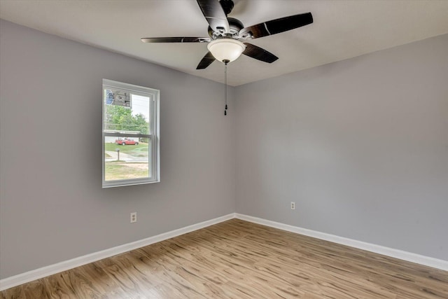 empty room featuring light hardwood / wood-style flooring and ceiling fan