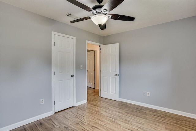 unfurnished bedroom with light hardwood / wood-style floors and ceiling fan