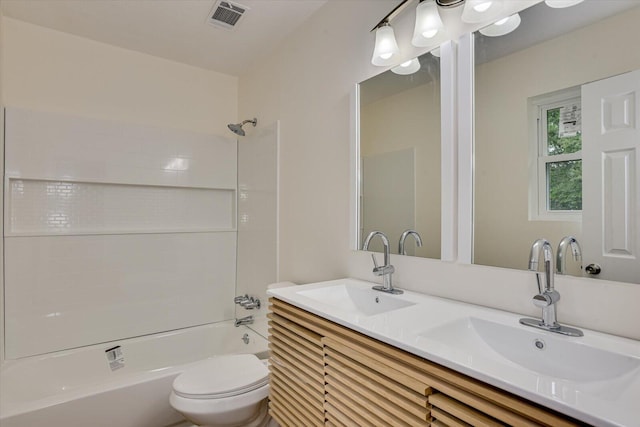 full bathroom with vanity, bathtub / shower combination, and toilet