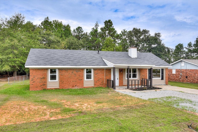 ranch-style home with a front lawn