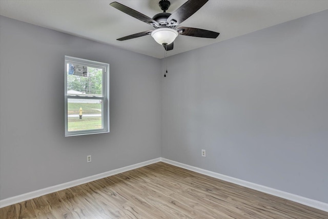 spare room featuring ceiling fan and light hardwood / wood-style flooring