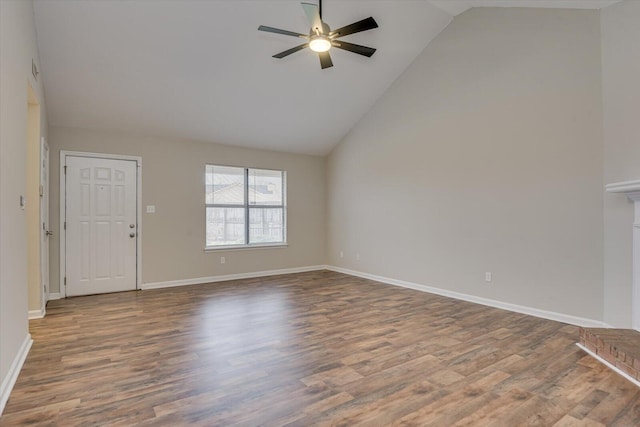 unfurnished living room featuring ceiling fan, baseboards, and wood finished floors