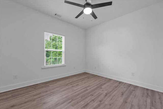 1116 Miller St, Augusta, GA 30901 - spare room featuring wood finished floors, baseboards, and a ceiling fan