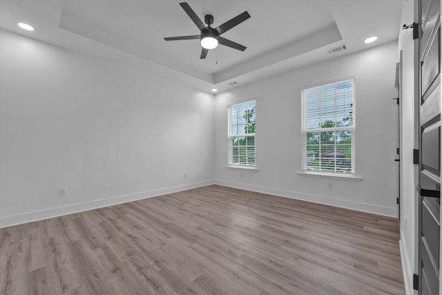1116 Miller St, Augusta, GA 30901 - unfurnished room with a tray ceiling, wood finished floors, recessed lighting, baseboards, and ceiling fan