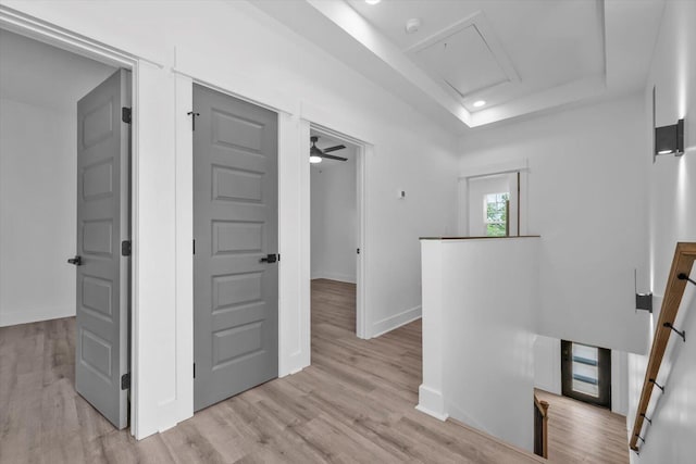 1116 Miller St, Augusta, GA 30901 - hall featuring an upstairs landing, light wood-type flooring, a raised ceiling, baseboards, and attic access
