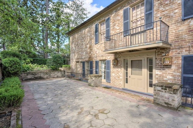 view of patio with a balcony