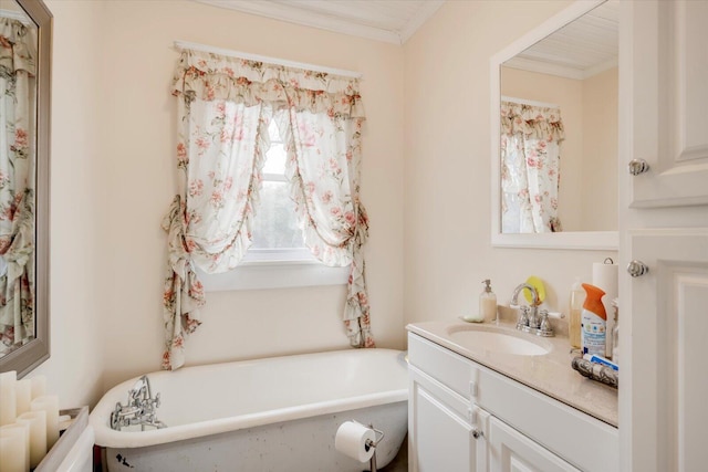 bathroom with a tub to relax in, ornamental molding, and vanity