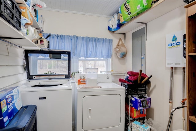 clothes washing area featuring independent washer and dryer and electric panel