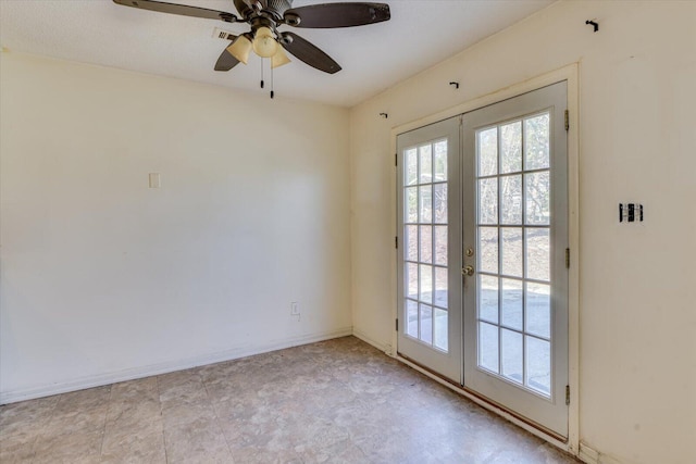 empty room featuring a ceiling fan, french doors, and baseboards