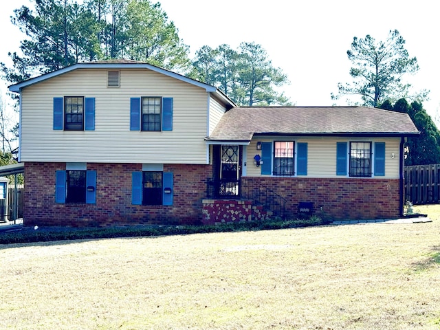 tri-level home featuring a front yard