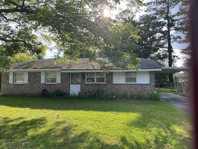 3323 Young Forest Dr, Augusta, GA 30906 - single story home featuring a front lawn, brick siding, a carport, and driveway