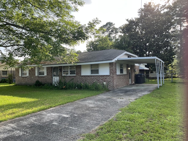 3323 Young Forest Dr, Augusta, GA 30906 - single story home with brick siding, a front yard, concrete driveway, and an attached carport