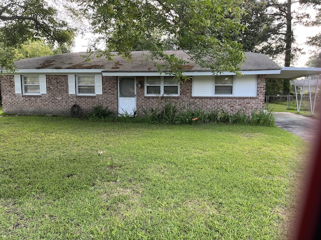 3323 Young Forest Dr, Augusta, GA 30906 - single story home with a front lawn, brick siding, and an attached carport