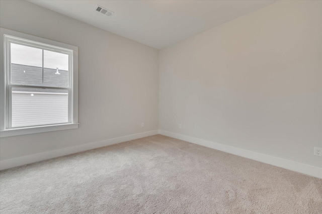 unfurnished room featuring carpet flooring