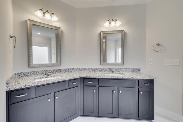 bathroom with tile patterned flooring and vanity