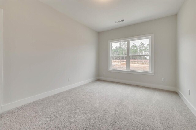 empty room with light colored carpet