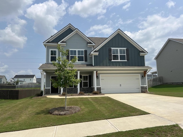 craftsman-style house featuring a garage and a front yard