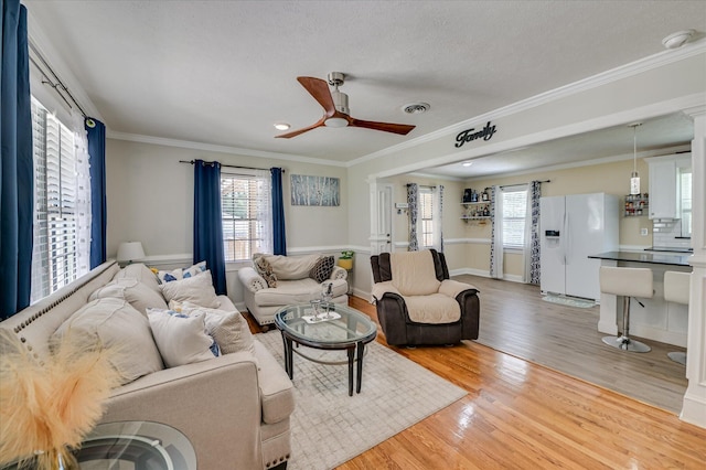 141 Whaley St, Warrenville, SC 29851 - living room featuring ceiling fan, healthy amount of natural light, wood finished floors, and crown molding