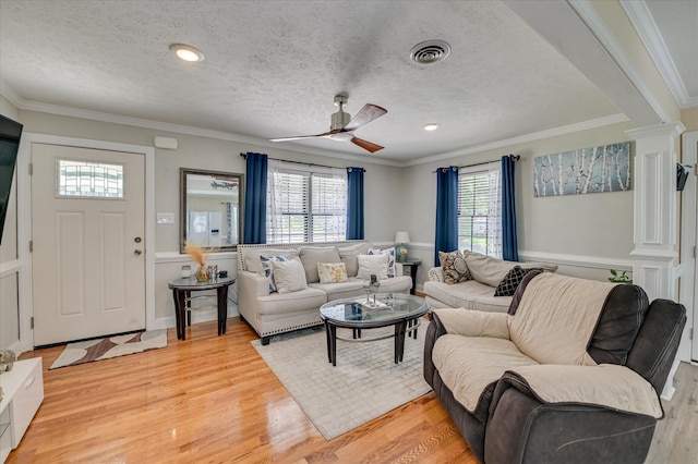 141 Whaley St, Warrenville, SC 29851 - living room with ornate columns, healthy amount of natural light, a ceiling fan, ornamental molding, and a textured ceiling