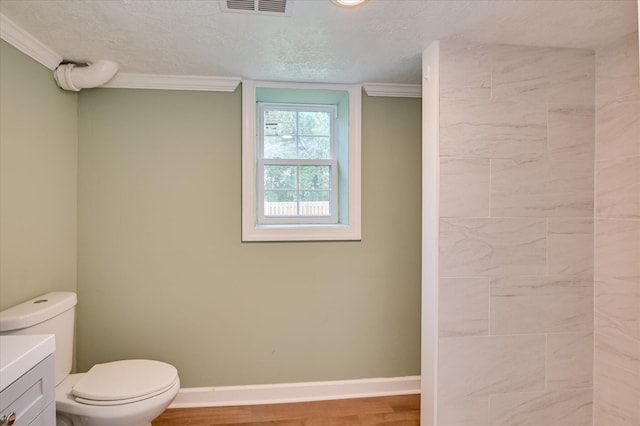 141 Whaley St, Warrenville, SC 29851 - full bath featuring ornamental molding, vanity, wood finished floors, and a textured ceiling