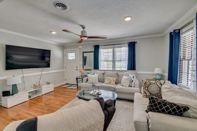 141 Whaley St, Warrenville, SC 29851 - living area featuring crown molding, wood finished floors, a ceiling fan, recessed lighting, and a textured ceiling