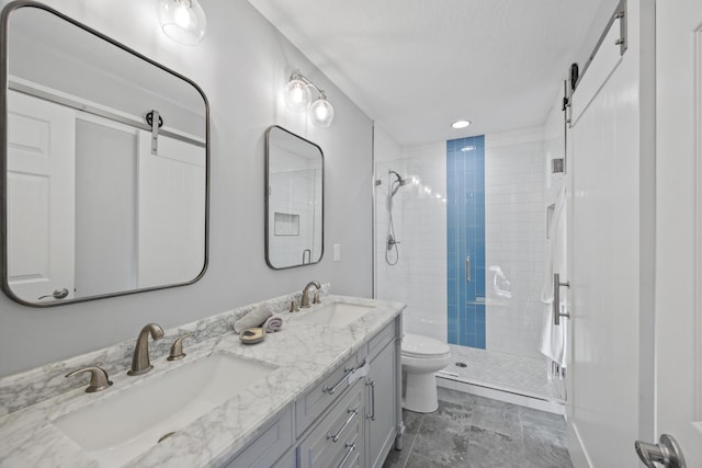 bathroom featuring vanity, toilet, and a shower with shower door