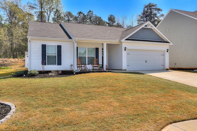 view of front of house with covered porch, a front yard, and a garage