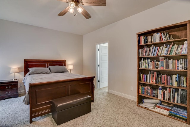 bedroom with ceiling fan and light colored carpet